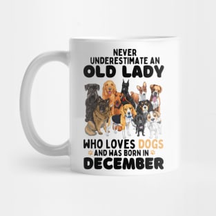 Never Underestimate An Old Lady Who Loves Dogs And Was Born In December Mug